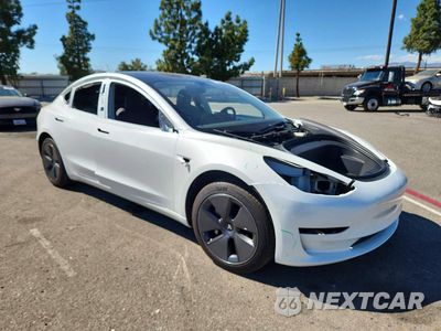 Czwarte zdjęcie samochodu z boku: 2023 TESLA MODEL 3 VIN:5YJ3E1EA0PF579802 - miniatura