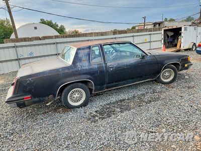 Trzecie zdjęcie samochodu z tyłu: 1987 OLDSMOBILE CUTLASS SUPREME VIN:1G3GR11Y5HP324630 - miniatura