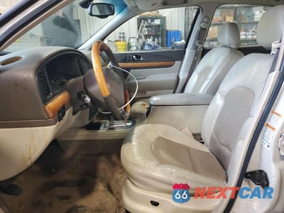 Zdjęcie 7 z 12 samochodu: 2002 LINCOLN CONTINENTAL VIN:1LNHM97V72Y659531 - miniatura