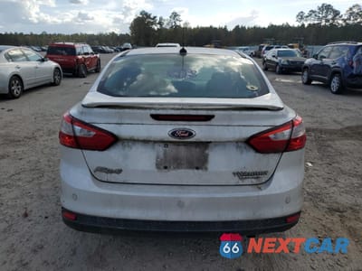 Zdjęcie 6 z 13 samochodu: 2013 FORD FOCUS TITANIUM VIN:1FADP3J25DL259382 - miniatura