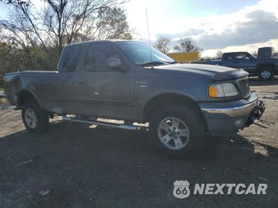 Czwarte zdjęcie samochodu z boku: 2002 FORD F150 VIN:1FTRX18L52NB14914 - miniatura