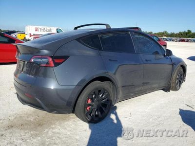 Trzecie zdjęcie samochodu z tyłu: 2022 TESLA MODEL Y VIN:7SAYGDEEXNF368353 - miniatura
