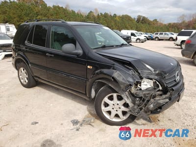 Czwarte zdjęcie samochodu z boku: 1999 MERCEDES-BENZ ML 430 VIN:4JGAB72E2XA060295 - miniatura