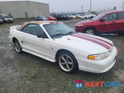 Czwarte zdjęcie samochodu z boku: 1994 FORD MUSTANG VIN:1FALP4447RF118267 - miniatura