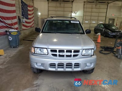 Piąte zdjęcie samochodu w środku: 2000 ISUZU RODEO S VIN:4S2DM58WXY4346884 - miniatura