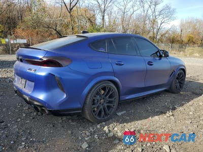 Trzecie zdjęcie samochodu z tyłu: 2021 BMW X6 M VIN:5YMCY0C0XM9E08406 - miniatura