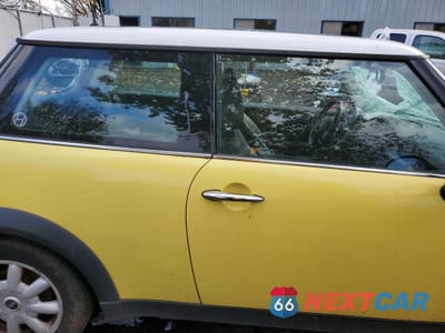 Zdjęcie 10 z 14 samochodu: 2004 MINI COOPER VIN:WMWRC334X4TJ61472 - miniatura