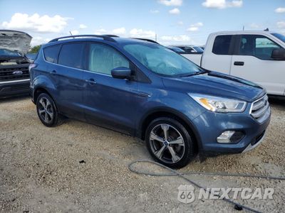 Czwarte zdjęcie samochodu z boku: 2018 FORD ESCAPE SEL VIN:1FMCU0HD1JUB05256 - miniatura