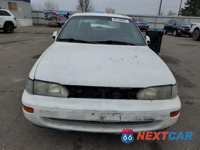 Piąte zdjęcie samochodu w środku: 1996 TOYOTA COROLLA DX VIN:2T1BB02E1TC175010 - miniatura