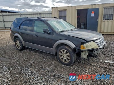 Czwarte zdjęcie samochodu z boku: 2009 FORD TAURUS X SEL VIN:1FMDK02W29GA03382 - miniatura