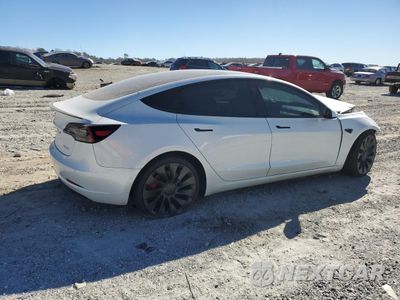 Trzecie zdjęcie samochodu z tyłu: 2021 TESLA MODEL 3 VIN:5YJ3E1EC6MF914526 - miniatura