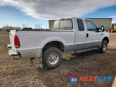 Trzecie zdjęcie samochodu z tyłu: 1999 FORD F250 SUPER DUTY VIN:1FTNX21S3XEE33516 - miniatura