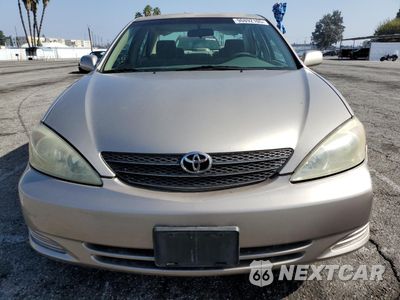 Piąte zdjęcie samochodu w środku: 2004 TOYOTA CAMRY LE VIN:JTDBE32K040266814 - miniatura