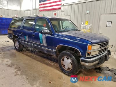 Czwarte zdjęcie samochodu z boku: 1993 CHEVROLET SUBURBAN K1500 VIN:1GNFK16K3PJ344968 - miniatura