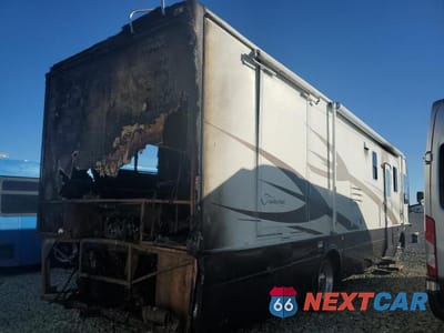 Czwarte zdjęcie samochodu z boku: 2001 NATIONAL RV TRADEWINDS RECREATIONAL VEHICLE VIN:4UZAAHAK51CH92760 - miniatura