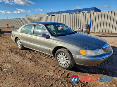 Czwarte zdjęcie samochodu z boku: 2000 LINCOLN CONTINENTAL VIN:1LNHM97V8YY892407 - miniatura