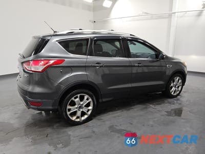 Trzecie zdjęcie samochodu z tyłu: 2016 FORD ESCAPE TITANIUM VIN:1FMCU9J93GUB85405 - miniatura