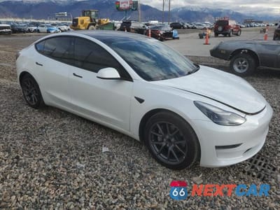 Czwarte zdjęcie samochodu z boku: 2021 TESLA MODEL 3 VIN:5YJ3E1EA6MF939473 - miniatura