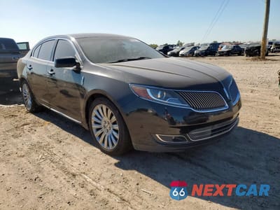 Czwarte zdjęcie samochodu z boku: 2014 LINCOLN MKS VIN:1LNHL9EK7EG600727 - miniatura