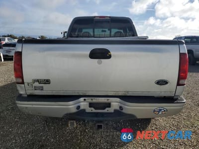 Zdjęcie 6 z 11 samochodu: 2000 FORD F-150 VIN:1FTRX18L2YKA96009 - miniatura