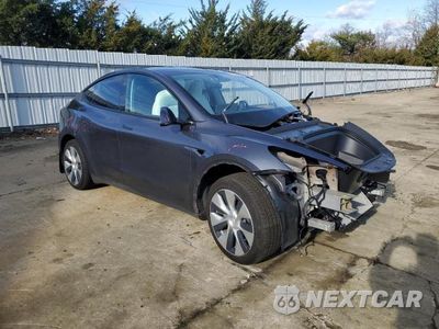 Czwarte zdjęcie samochodu z boku: 2023 TESLA MODEL Y VIN:7SAYGAEE4PF888498 - miniatura