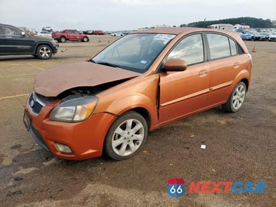 2010 KIA RIO LX KNADH5A33A6659055 - główne zdjęcie licytacji z USA - miniatura