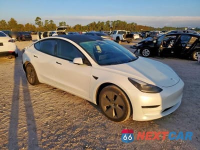 Czwarte zdjęcie samochodu z boku: 2023 TESLA MODEL 3 VIN:5YJ3E1EA8PF590482 - miniatura