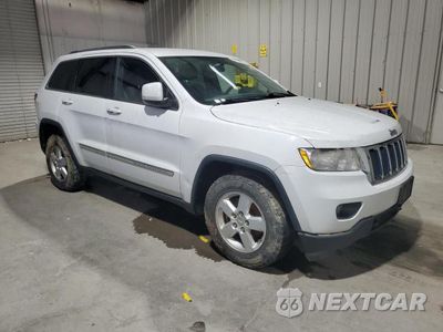 Czwarte zdjęcie samochodu z boku: 2013 JEEP GRAND CHEROKEE LAREDO VIN:1C4RJFAG9DC598953 - miniatura