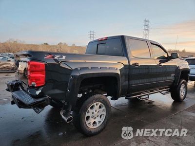 Trzecie zdjęcie samochodu z tyłu: 2018 CHEVROLET SILVERADO K1500 LT VIN:3GCUKREC0JG515659 - miniatura