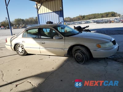 Czwarte zdjęcie samochodu z boku: 2002 LINCOLN CONTINENTAL VIN:1LNHM97V12Y690290 - miniatura