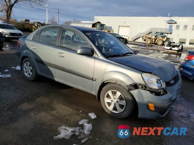 Czwarte zdjęcie samochodu z boku: 2009 KIA RIO BASE VIN:KNADE223296566738 - miniatura