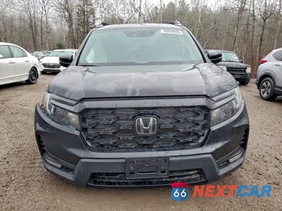 Piąte zdjęcie samochodu w środku: 2022 HONDA PASSPORT TOURING VIN:5FNYF8H97NB502323 - miniatura