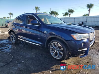 Czwarte zdjęcie samochodu z boku: 2015 BMW X4 XDRIVE35I VIN:5UXXW5C51F0E87821 - miniatura