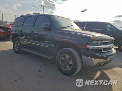 Czwarte zdjęcie samochodu z boku: 2003 CHEVROLET TAHOE C1500 VIN:1GNEC13ZX3R143901 - miniatura