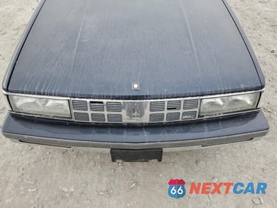 Zdjęcie 11 z 14 samochodu: 1990 OLDSMOBILE 98 REGENCY VIN:1G3CX54CXL4356754 - miniatura