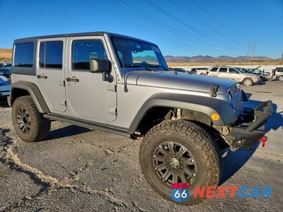 Czwarte zdjęcie samochodu z boku: 2013 JEEP WRANGLER UNLIMITED SPORT VIN:1C4HJWDG6DL682350 - miniatura