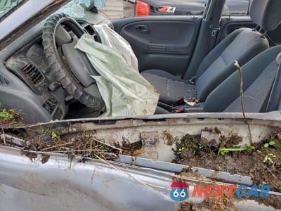 Zdjęcie 7 z 11 samochodu: 2000 CHEVROLET TRACKER VIN:2CNBJ13C6Y6910753 - miniatura