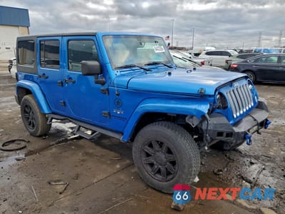 Czwarte zdjęcie samochodu z boku: 2016 JEEP WRANGLER UNLIMITED SAHARA VIN:1C4BJWEG5GL310295 - miniatura