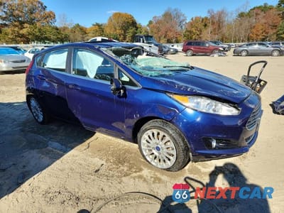 Czwarte zdjęcie samochodu z boku: 2016 FORD FIESTA TITANIUM VIN:3FADP4FJ4GM201918 - miniatura