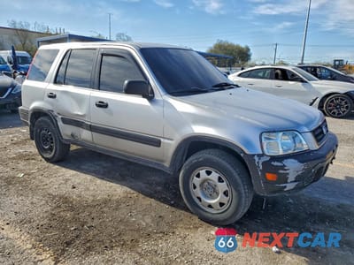 Czwarte zdjęcie samochodu z boku: 1999 HONDA CR-V LX VIN:JHLRD1744XC023691 - miniatura