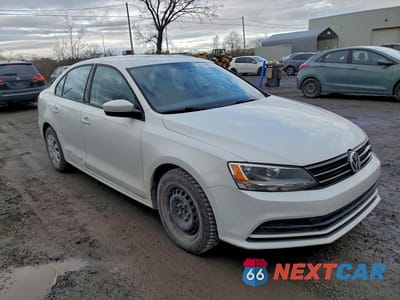 Czwarte zdjęcie samochodu z boku: 2017 VOLKSWAGEN JETTA S VIN:3VW2B7AJ3HM307140 - miniatura