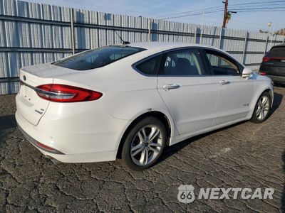 Trzecie zdjęcie samochodu z tyłu: 2018 FORD FUSION SE HYBRID VIN:3FA6P0LU1JR118697 - miniatura