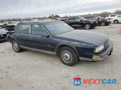 Czwarte zdjęcie samochodu z boku: 1990 OLDSMOBILE 98 REGENCY VIN:1G3CX54CXL4356754 - miniatura