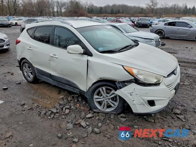 Czwarte zdjęcie samochodu z boku: 2010 HYUNDAI TUCSON GLS VIN:KM8JUCAC6AU080462 - miniatura