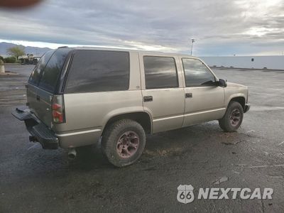 Trzecie zdjęcie samochodu z tyłu: 1999 GMC YUKON VIN:1GKEC13R5XJ801805 - miniatura