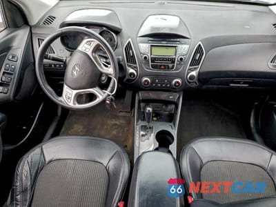 Zdjęcie 8 z 13 samochodu: 2010 HYUNDAI TUCSON GLS VIN:KM8JUCAC6AU080462 - miniatura