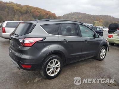 Trzecie zdjęcie samochodu z tyłu: 2018 FORD ESCAPE SEL VIN:1FMCU9HD5JUC21063 - miniatura