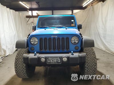 Piąte zdjęcie samochodu w środku: 2015 JEEP WRANGLER UNLIMITED SPORT VIN:1C4BJWDG5FL692134 - miniatura