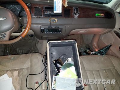 Zdjęcie 8 z 14 samochodu: 1999 LINCOLN TOWN CAR CARTIER VIN:1LNHM83W7XY691721 - miniatura