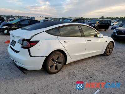 Trzecie zdjęcie samochodu z tyłu: 2023 TESLA MODEL 3 VIN:5YJ3E1EA8PF590482 - miniatura